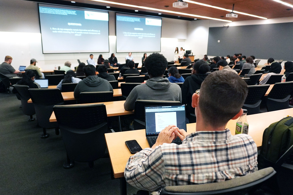 Panelists speaking to a classroom of students.